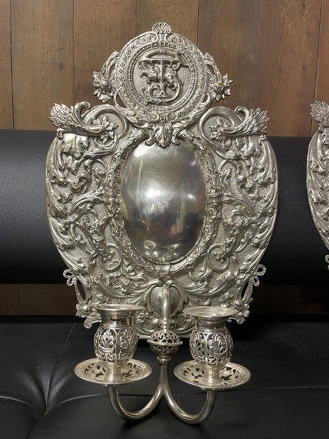 Pair of 19th century silver-plated sconces / candleholders. Decorative Renaissance style sconces with 2 candles. 1 of the sconces is much lighter and possibly silver. Dimensions: Height : 54 cm Width : 34 cm Depth : 14 cm In good condition