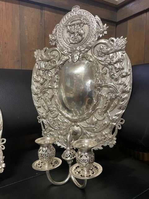 Pair of 19th century silver-plated sconces / candleholders. Decorative Renaissance style sconces with 2 candles. 1 of the sconces is much lighter and possibly silver. Dimensions: Height : 54 cm Width : 34 cm Depth : 14 cm In good condition