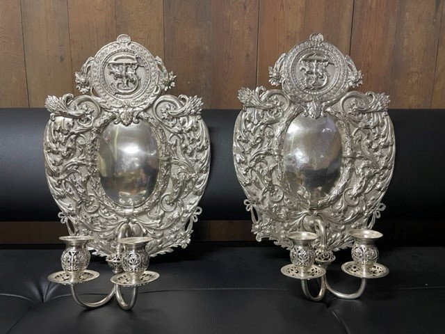 Pair of 19th century silver-plated sconces / candleholders. Decorative Renaissance style sconces with 2 candles. 1 of the sconces is much lighter and possibly silver. Dimensions: Height : 54 cm Width : 34 cm Depth : 14 cm In good condition