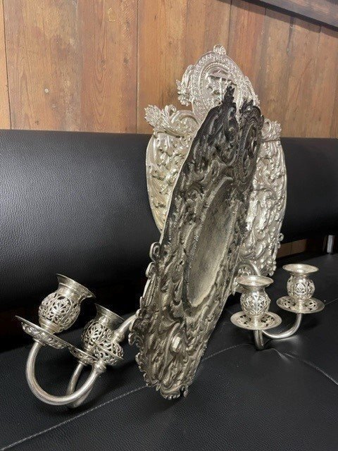 Pair of 19th century silver-plated sconces / candleholders. Decorative Renaissance style sconces with 2 candles. 1 of the sconces is much lighter and possibly silver. Dimensions: Height : 54 cm Width : 34 cm Depth : 14 cm In good condition