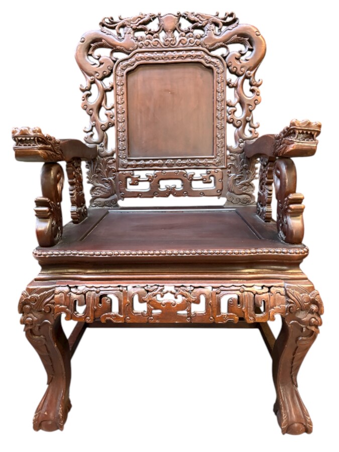 Pair of Asian solid wood armchairs, 20th century Decorative armchairs adorned with magnificent dragons and dragon heads as armrests. Dimensions: Height: 119 cm Width: 76 cm Depth: 67 cm Heavy solid wood armchairs in good condition, 20th century.