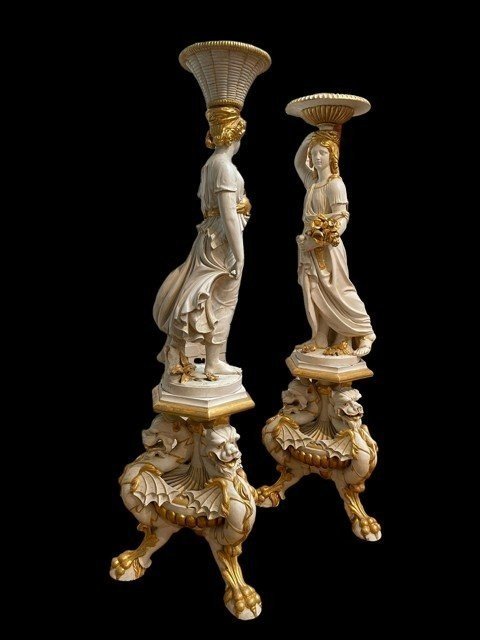 Pair of beautiful 19thc entury wooden pedestal sculptures. Very decorative female figures, finely carved in white with golden accents, resting on magnificent pedestals.