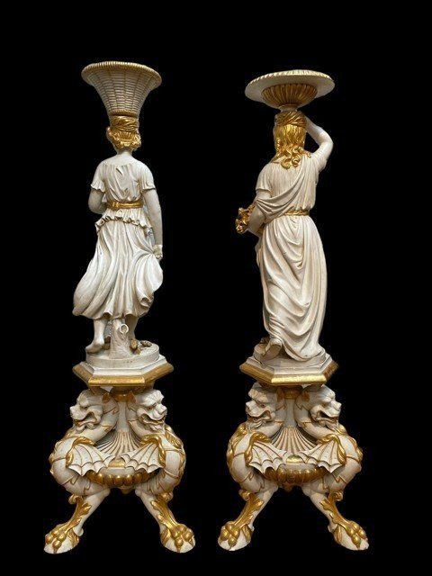 Pair of beautiful 19thc entury wooden pedestal sculptures. Very decorative female figures, finely carved in white with golden accents, resting on magnificent pedestals.