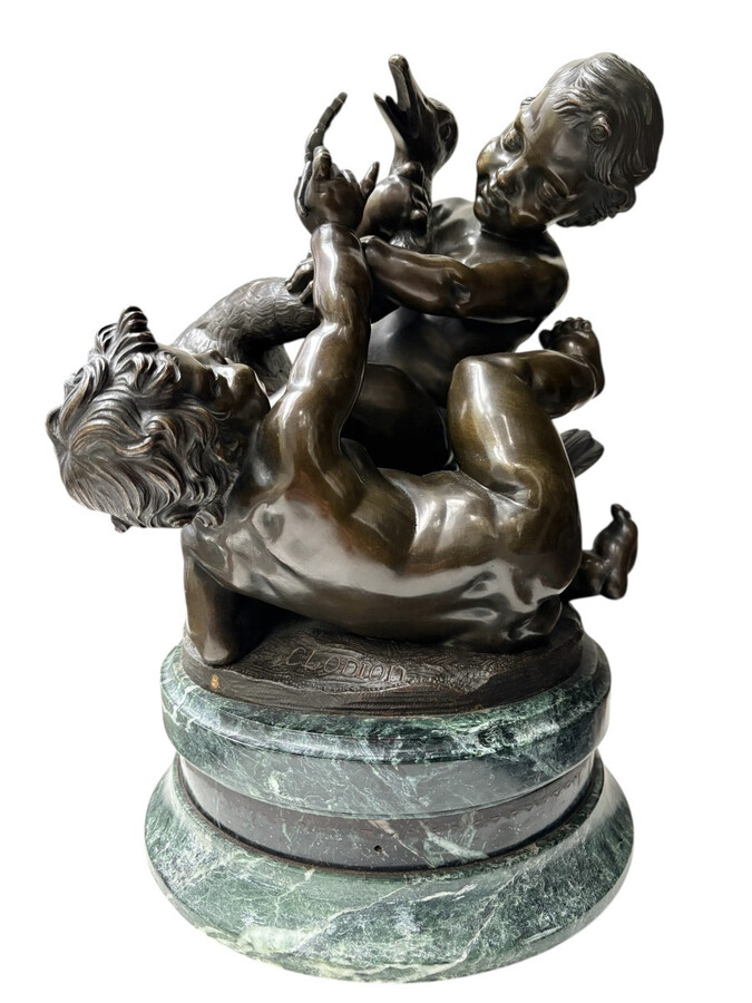 Pair of bronze sculptures ‘putti with swan’ after Clodion, 19th century Attractive pair of decorative bronze sculptures mounted on a marble base. Both sculptures are signed Clodion / Cresson éditeur.