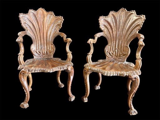 Pair Of Carved Walnut Cave Armchairs 20th C. A very fine pair of Venice carved walnut cave armchairs with a small table. The armchairs, shell-shaped, are all done in the typical style for decoration that was the fashion in Venice in the 19th century. 