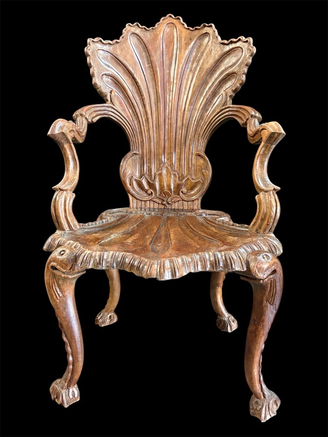 Pair Of Carved Walnut Cave Armchairs 20th C. A very fine pair of Venice carved walnut cave armchairs with a small table. The armchairs, shell-shaped, are all done in the typical style for decoration that was the fashion in Venice in the 19th century. 