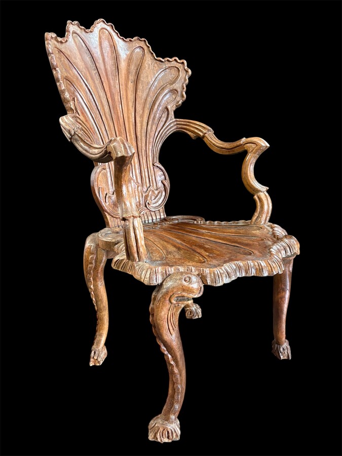 Pair Of Carved Walnut Cave Armchairs 20th C. A very fine pair of Venice carved walnut cave armchairs with a small table. The armchairs, shell-shaped, are all done in the typical style for decoration that was the fashion in Venice in the 19th century. 