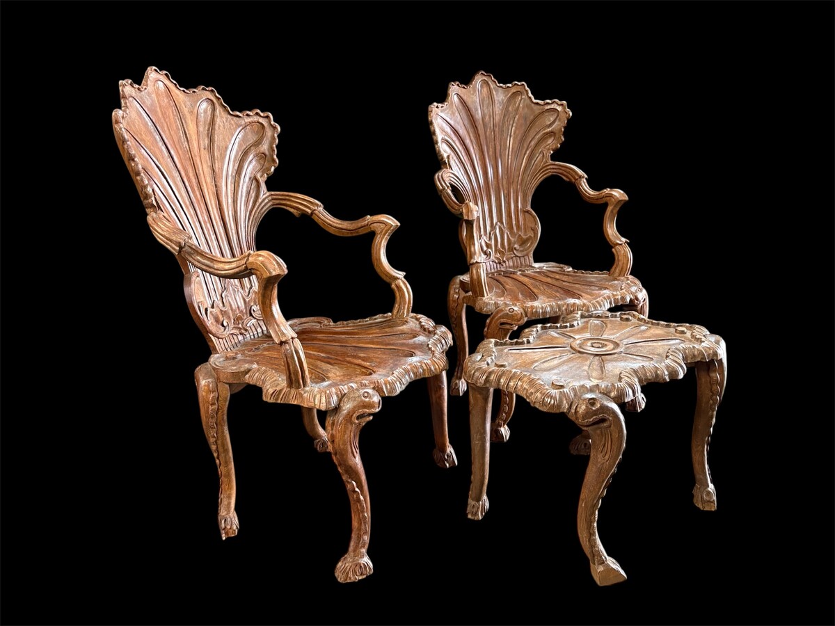 Pair Of Carved Walnut Cave Armchairs 20th C. A very fine pair of Venice carved walnut cave armchairs with a small table. The armchairs, shell-shaped, are all done in the typical style for decoration that was the fashion in Venice in the 19th century. 