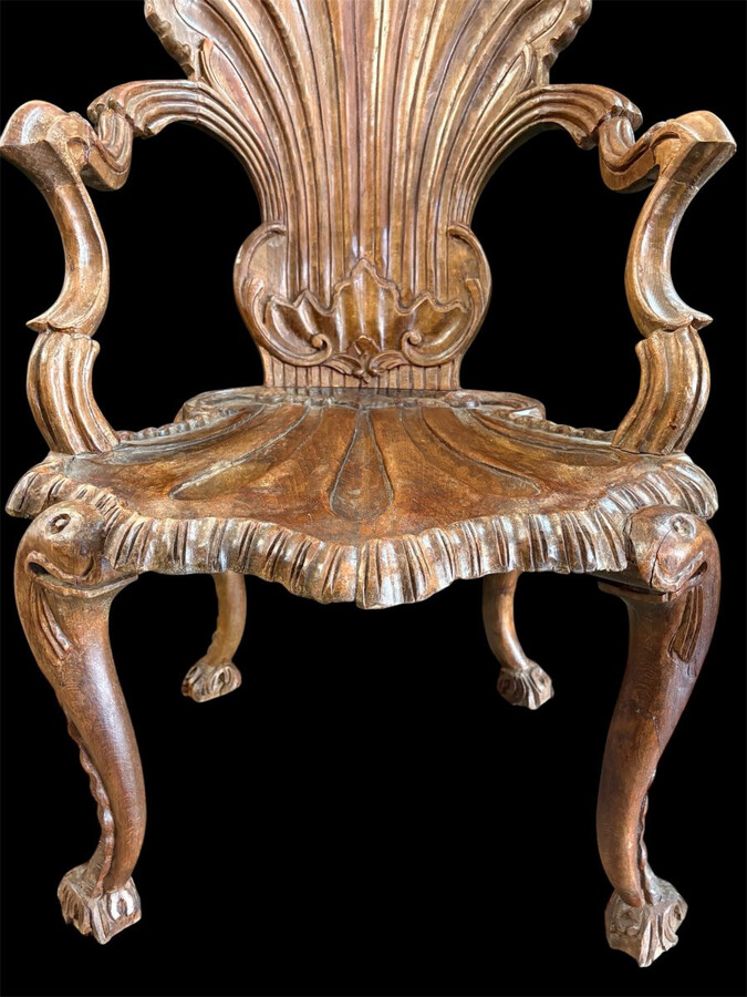 Pair Of Carved Walnut Cave Armchairs 20th C. A very fine pair of Venice carved walnut cave armchairs with a small table. The armchairs, shell-shaped, are all done in the typical style for decoration that was the fashion in Venice in the 19th century.