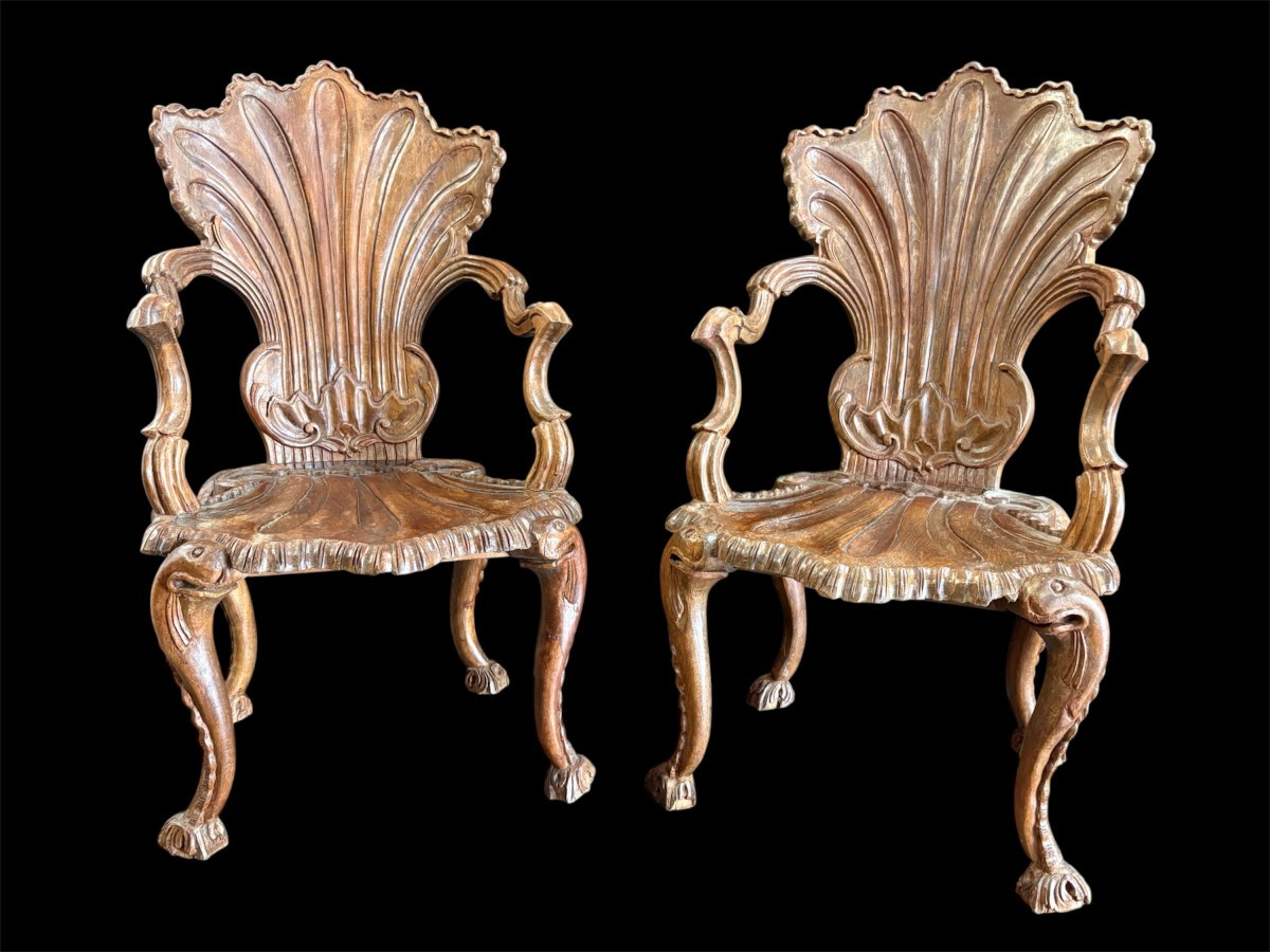 Pair Of Carved Walnut Cave Armchairs 20th C. A very fine pair of Venice carved walnut cave armchairs with a small table. The armchairs, shell-shaped, are all done in the typical style for decoration that was the fashion in Venice in the 19th century.