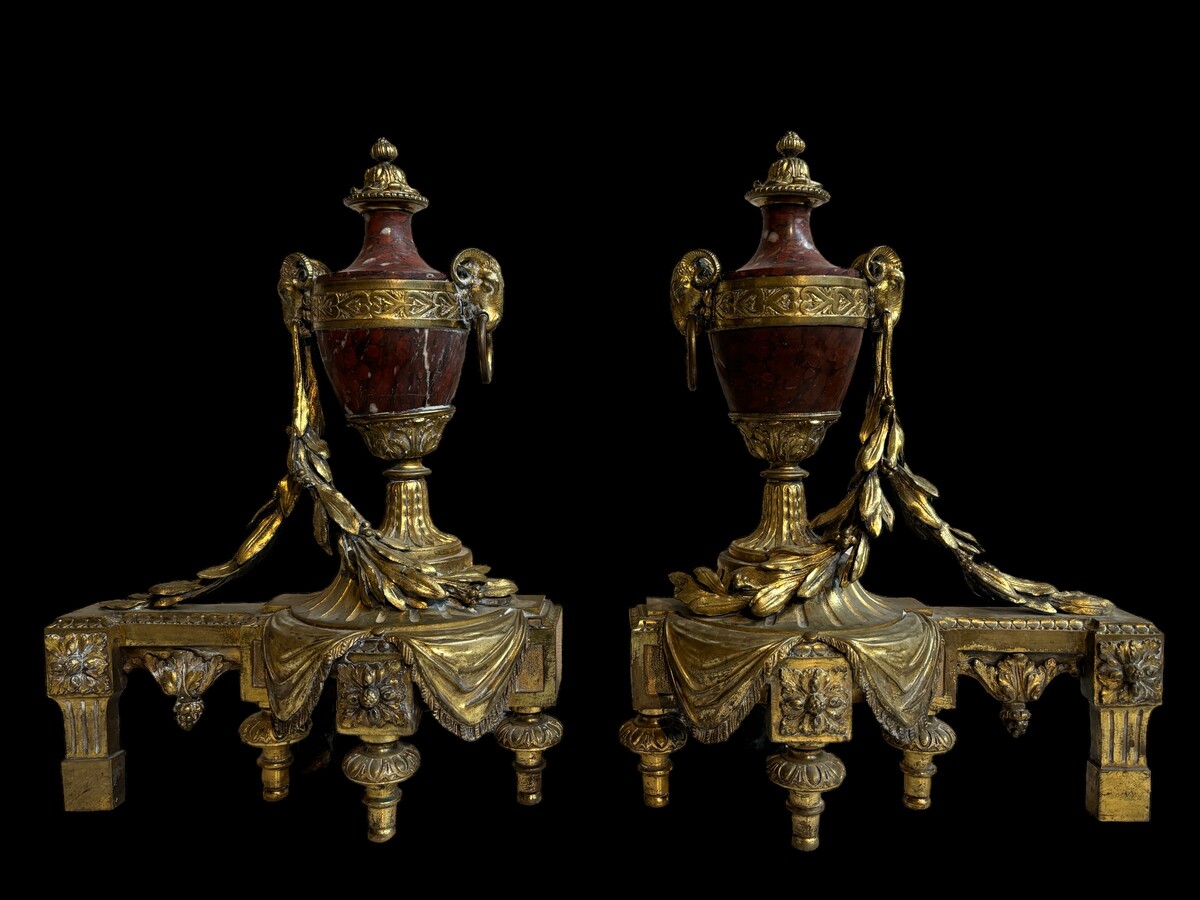 Pair of chenets Louis XVI style in gilt bronze and marble 19th century Beautiful pair of chenets with following dimensions : Height : 48 cm Width : 36 cm Depth : 19 cm In good condition , mid 19th century
