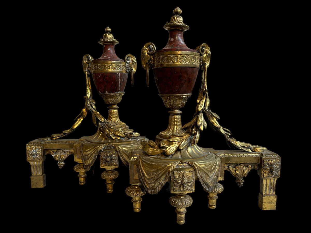 Pair of chenets Louis XVI style in gilt bronze and marble 19th century Beautiful pair of chenets with following dimensions : Height : 48 cm Width : 36 cm Depth : 19 cm In good condition , mid 19th century