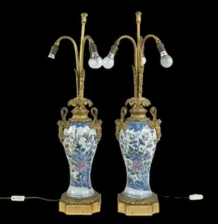 Pair of Chinese famille rose vases transformed into lampadaires 19ème. Nice lamps with gilt bronze mounts , 19thCentury Dimensions : Height : 78 cm base : 16 x 16 cm In very good condition, 19thC.
