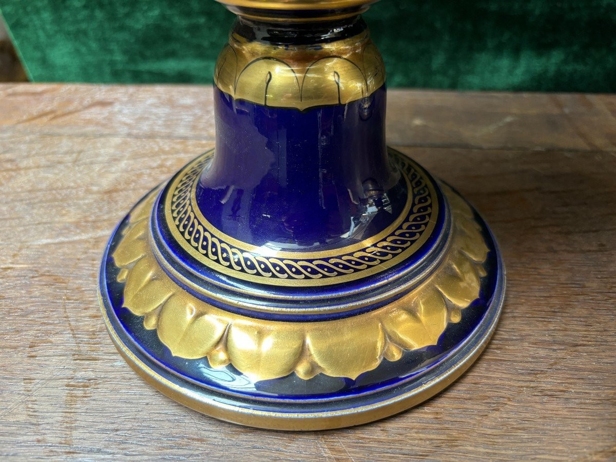  Pair of Empire style porcelain vases Sèvres , 20th Century Pair of vases with romantic paintings in blue and gilt tones. Signed by G.Etemod and underneath marked with Sèvres sign Dimensions : Height : 55 cm Width : 28 cm Diameter foot : 18 cm