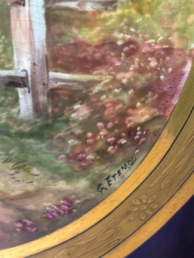 Pair of Empire style porcelain vases Sèvres , 20th Century Pair of vases with romantic paintings in blue and gilt tones. Signed by G.Etemod and underneath marked with Sèvres sign Dimensions : Height : 55 cm Width : 28 cm Diameter foot : 18 cm In