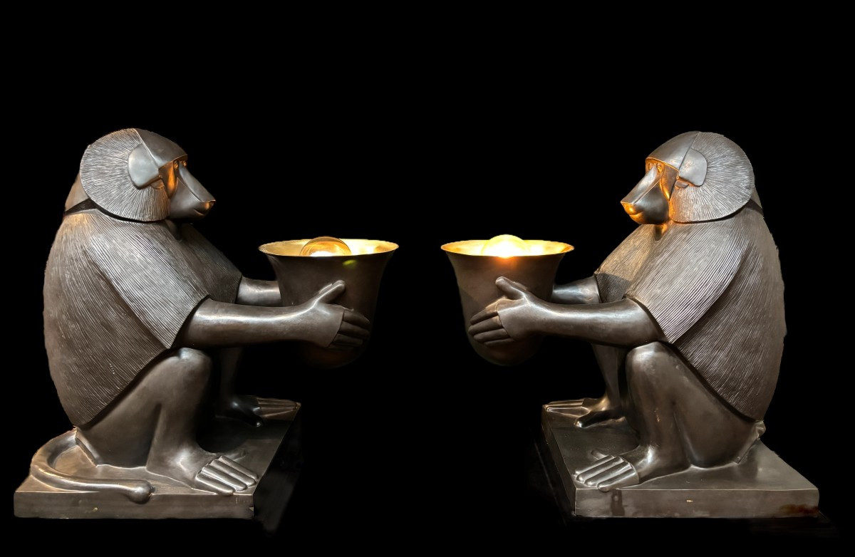 Pair of large ‘Baboons’ bronze lamps in the Art Deco style A highly decorative bronze sculpture/lamp in Art Deco style, depicting a large, finely detailed bronze baboon holding a vase containing a lamp. 