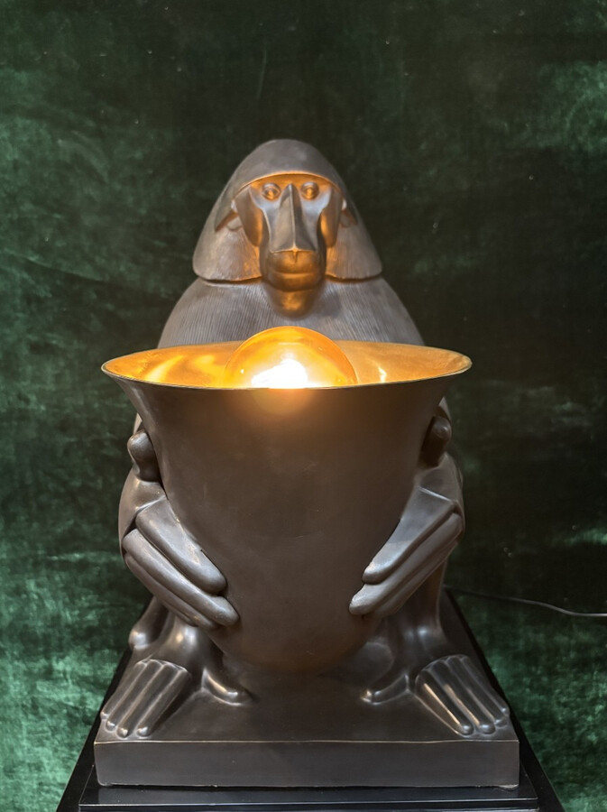 Pair of large ‘Baboons’ bronze lamps in the Art Deco style A highly decorative bronze sculpture/lamp in Art Deco style, depicting a large, finely detailed bronze baboon holding a vase containing a lamp. 