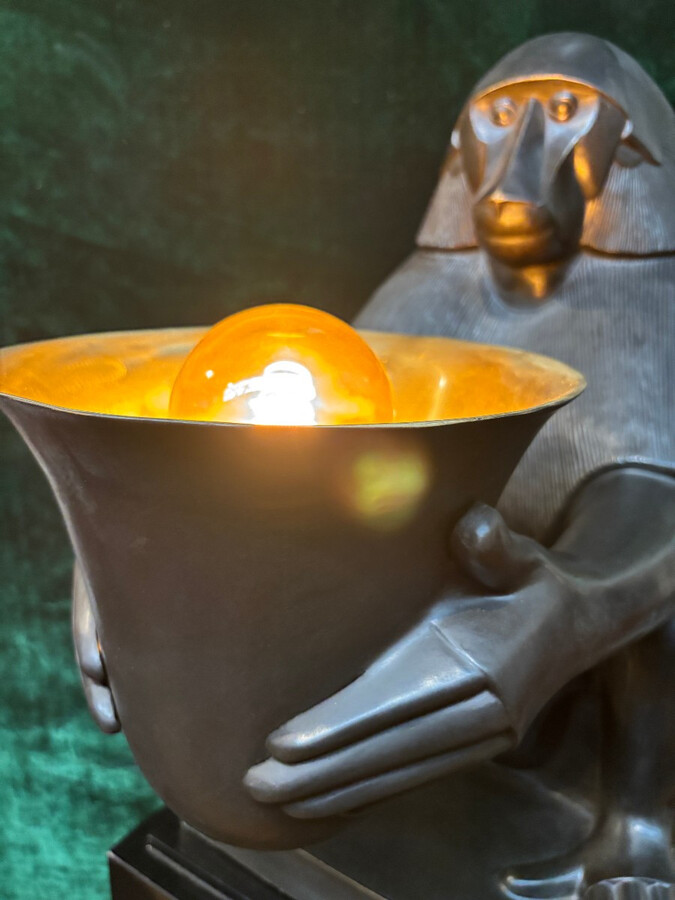 Pair of large ‘Baboons’ bronze lamps in the Art Deco style A highly decorative bronze sculpture/lamp in Art Deco style, depicting a large, finely detailed bronze baboon holding a vase containing a lamp. 