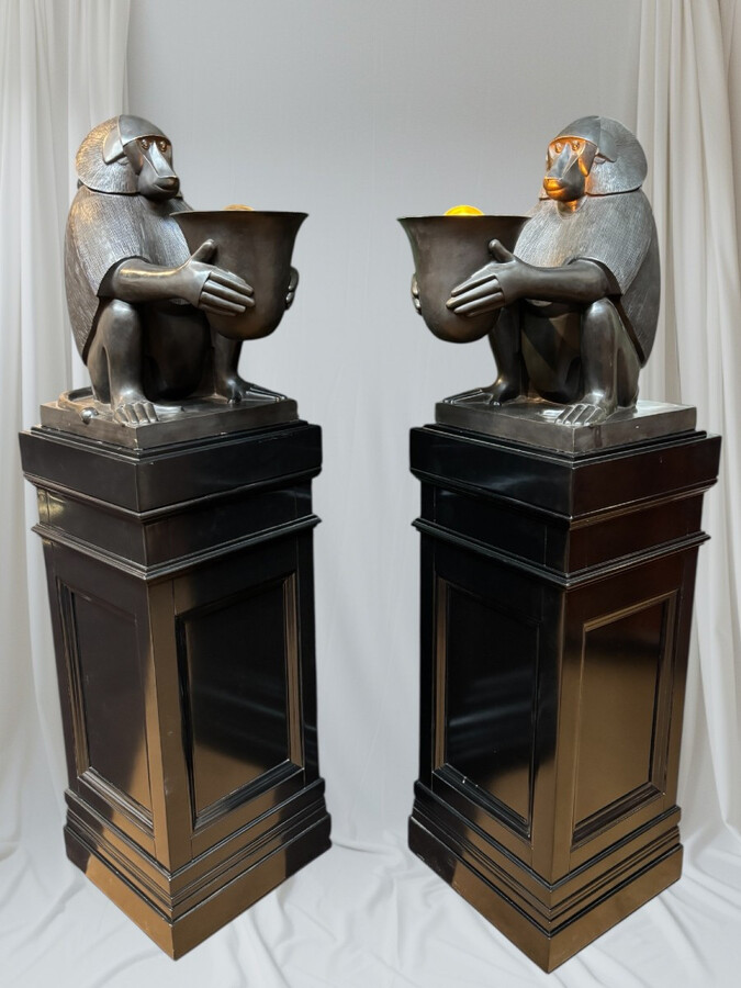 Pair of large ‘Baboons’ bronze lamps in the Art Deco style A highly decorative bronze sculpture/lamp in Art Deco style, depicting a large, finely detailed bronze baboon holding a vase containing a lamp. 