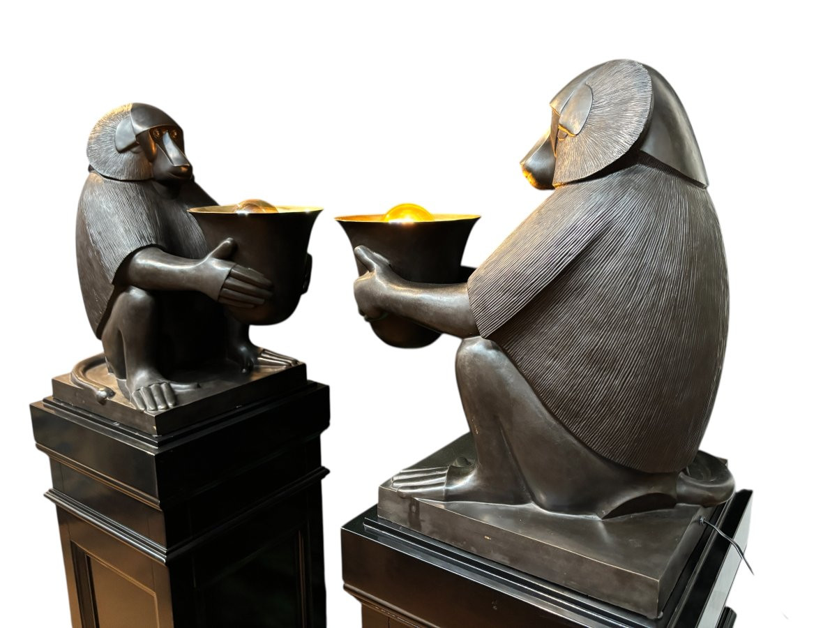 Pair of large ‘Baboons’ bronze lamps in the Art Deco style A highly decorative bronze sculpture/lamp in Art Deco style, depicting a large, finely detailed bronze baboon holding a vase containing a lamp. 