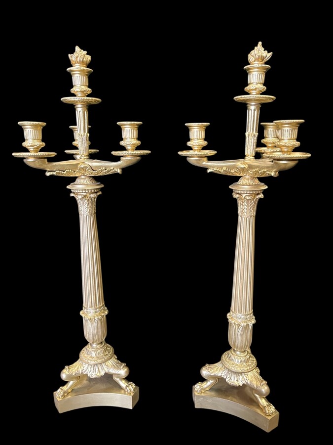 Pair of large bronze candelabra (71 cm) in Empire style, 19th century Large decorative candelabra with 4 candle holders Both in very good condition, gilding not original. Dimensions: Height: 71 cm French manufacture, 19th century.