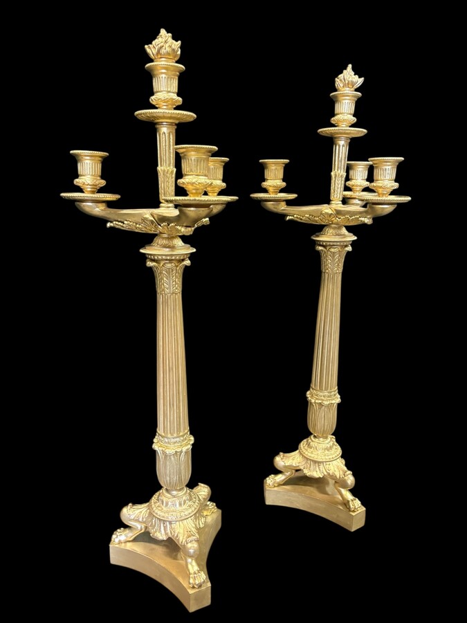 Pair of large bronze candelabra (71 cm) in Empire style, 19th century Large decorative candelabra with 4 candle holders Both in very good condition, gilding not original. Dimensions: Height: 71 cm French manufacture, 19th century.