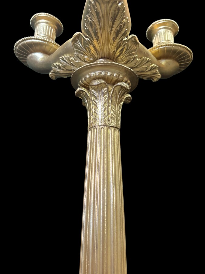 Pair of large bronze candelabra (71 cm) in Empire style, 19th century Large decorative candelabra with 4 candle holders Both in very good condition, gilding not original. Dimensions: Height: 71 cm French manufacture, 19th century.