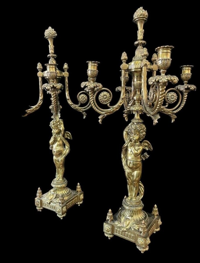 Pair of large candelabras with angels in 19th century bronze. Large Louis XVI style candelabra with 4 candlesticks. Dimensions: Height : 76 cm Width : 30 cm Depth : 32 cm Base: 16.5 x 16.5 cm Pair of large candelabras with angels in 19th century bronze.