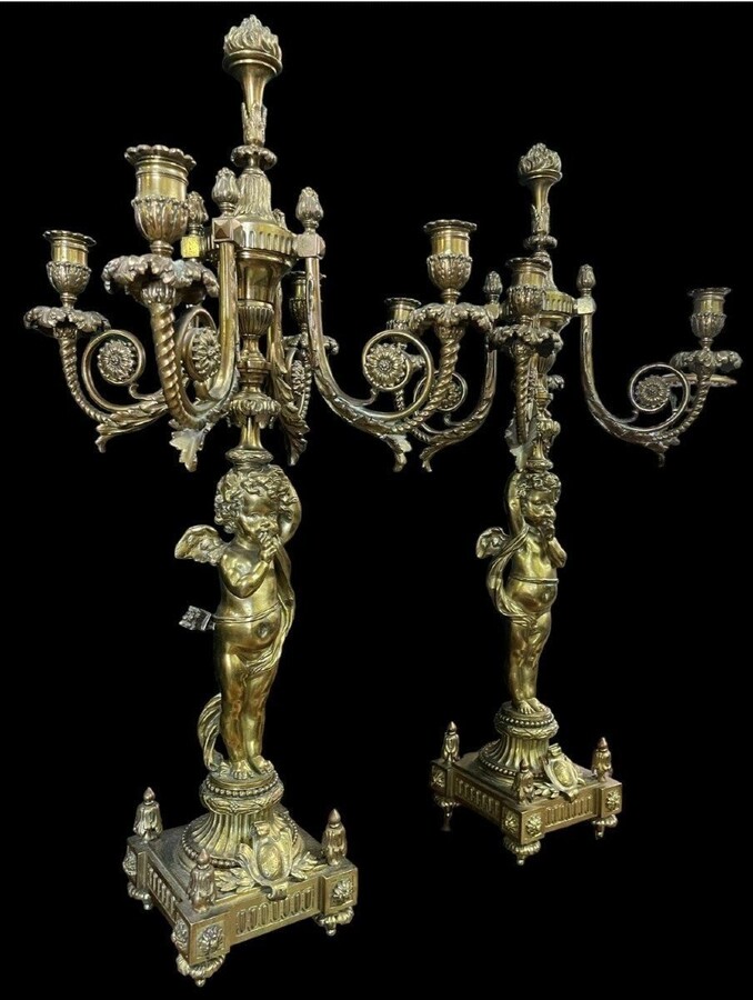 Pair of large candelabras with angels in 19th century bronze. Large Louis XVI style candelabra with 4 candlesticks. Dimensions: Height : 76 cm Width : 30 cm Depth : 32 cm Base: 16.5 x 16.5 cm Pair of large candelabras with angels in 19th century bronze.