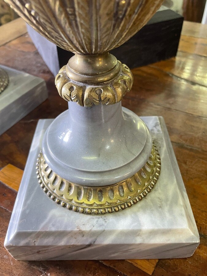 Pair of large casollettes in grey marble/bronze 19th century. Decorated with bronze girlandes , rams heads and ornaments. Both in very good condition Dimensions : Height : 52 cm Width : 21 cm Foot : 14 x 14 cm Decorative Casollettts from about 1860-1870