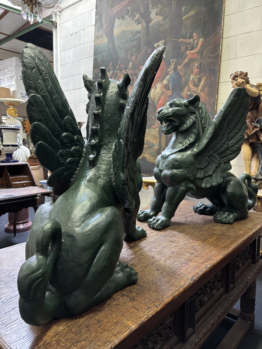 Pair of large Empire style mythological winged lions in cast iron 20th Very decorative sculptures for the garden or interior with the following dimensions: Height: 83 cm Width: 47 cm Length: 89 cm
