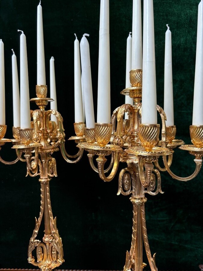 Pair of large gilt bronze candlesticks Napoleon III Very elegant candlesticks with 7 candleholders , decorated with ornaments and resting on a gilt bronze / white marble base Dimensions : Height : 74 cm Width : 31 cm Both are in good condition