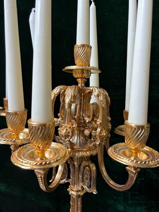 Pair of large gilt bronze candlesticks Napoleon III Very elegant candlesticks with 7 candleholders , decorated with ornaments and resting on a gilt bronze / white marble base Dimensions : Height : 74 cm Width : 31 cm Both are in good condition