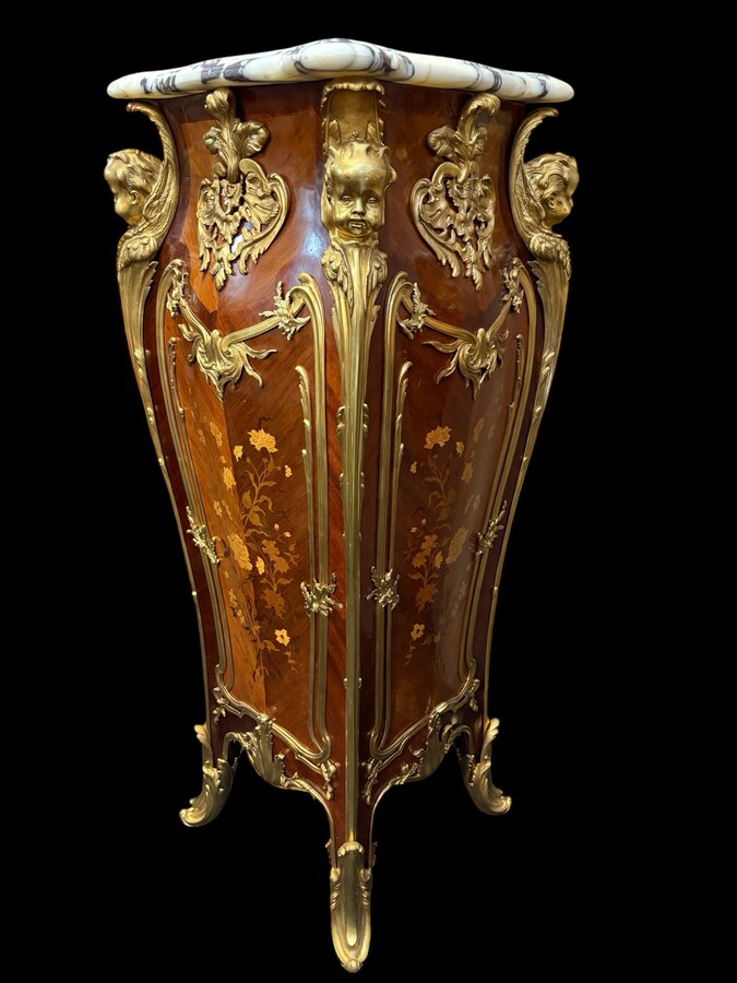Pair of large Louis XV style marquetry/bronze columns, 20th century. High-quality columns adorned with fine marquetry and decorated with angels, ornaments and bronze feet, topped with magnificent marble. The columns are decorated all around.