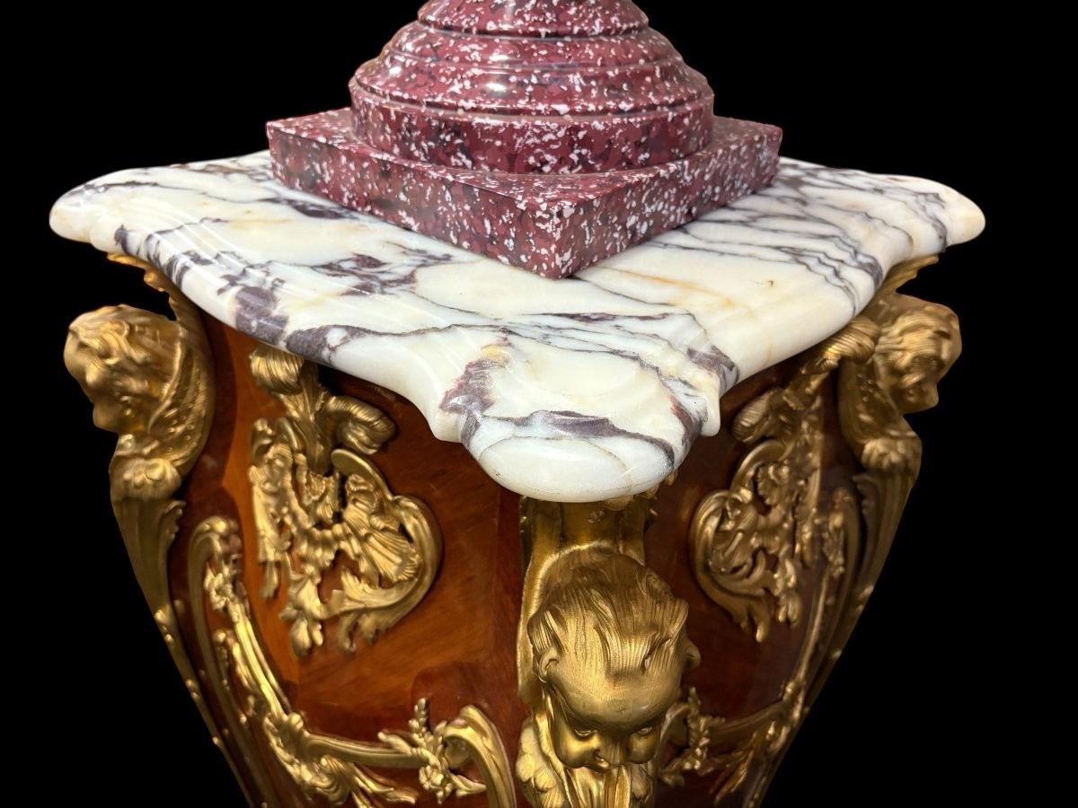 Pair of large Louis XV style marquetry/bronze columns, 20th century. High-quality columns adorned with fine marquetry and decorated with angels, ornaments and bronze feet, topped with magnificent marble. The columns are decorated all around.