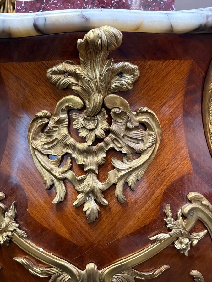 Pair of large Louis XV style marquetry/bronze columns, 20th century. High-quality columns adorned with fine marquetry and decorated with angels, ornaments and bronze feet, topped with magnificent marble. The columns are decorated all around.