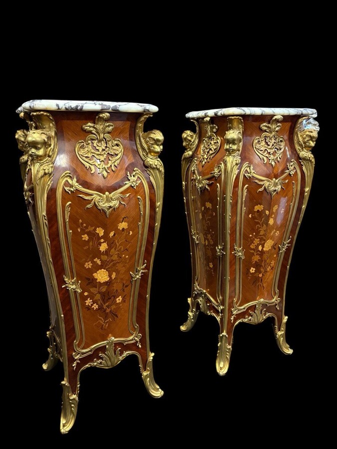 Pair of large Louis XV style marquetry/bronze columns, 20th century. High-quality columns adorned with fine marquetry and decorated with angels, ornaments and bronze feet, topped with magnificent marble. The columns are decorated all around.