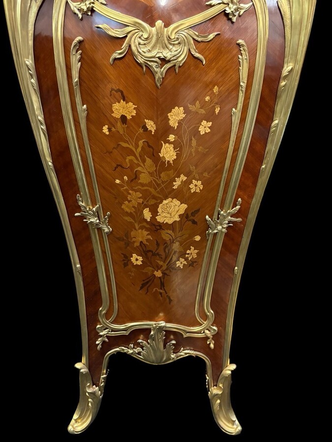Pair of large Louis XV style marquetry/bronze columns, 20th century. High-quality columns adorned with fine marquetry and decorated with angels, ornaments and bronze feet, topped with magnificent marble. The columns are decorated all around.