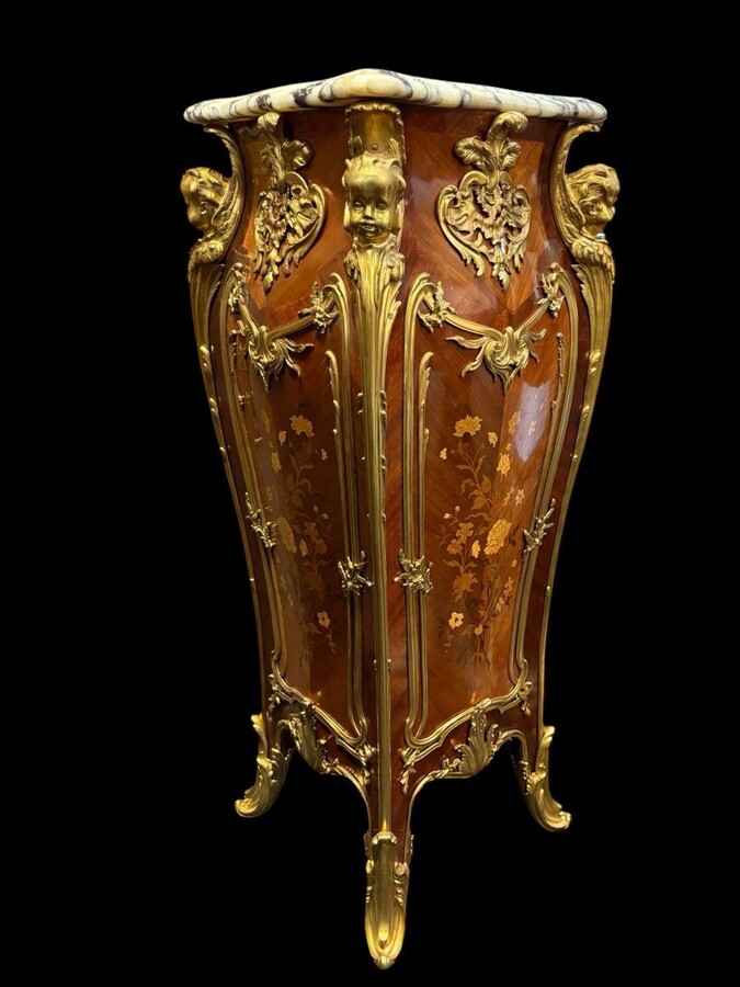 Pair of large Louis XV style marquetry/bronze columns, 20th century. High-quality columns adorned with fine marquetry and decorated with angels, ornaments and bronze feet, topped with magnificent marble. The columns are decorated all around.