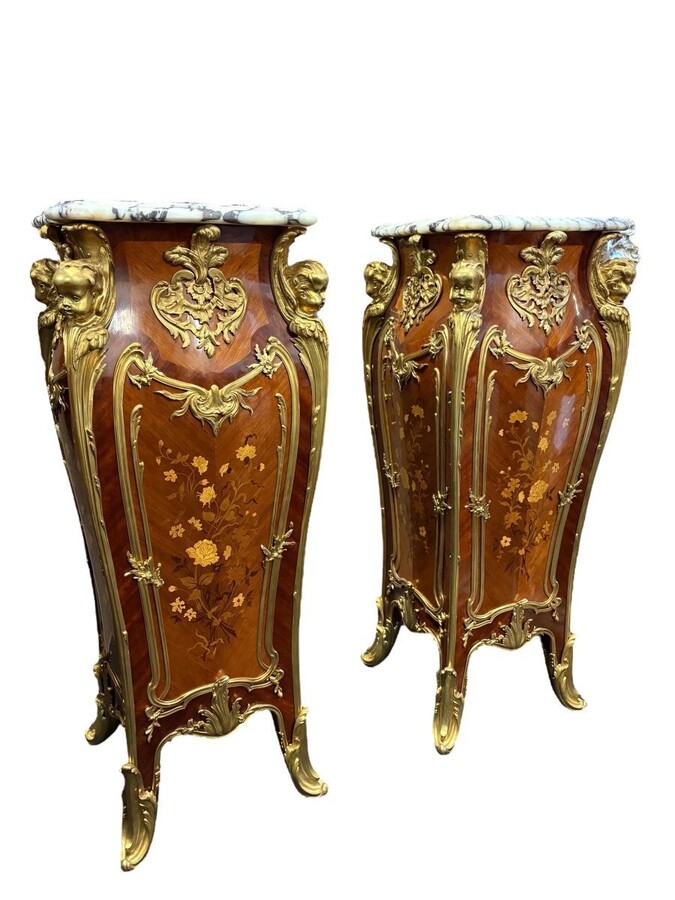 Pair of large Louis XV style marquetry/bronze columns, 20th century. High-quality columns adorned with fine marquetry and decorated with angels, ornaments and bronze feet, topped with magnificent marble. The columns are decorated all around.