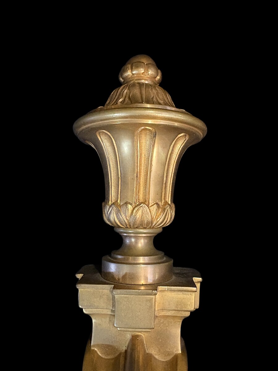 Pair of large Louis XVI-style bronze wall sconces, 19th century High-quality bronze wall sconces, chiselled, featuring an elegant design with two light points and a vase crowning the ensemble Dimensions: Height: 62 cm Width: 42 cm Depth: 22 cm