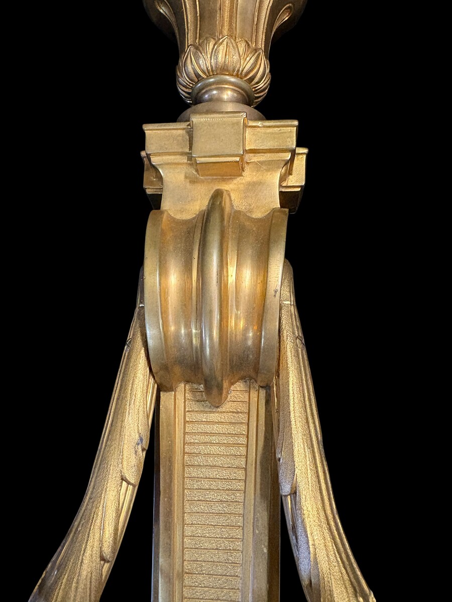 Pair of large Louis XVI-style bronze wall sconces, 19th century High-quality bronze wall sconces, chiselled, featuring an elegant design with two light points and a vase crowning the ensemble Dimensions: Height: 62 cm Width: 42 cm Depth: 22 cm