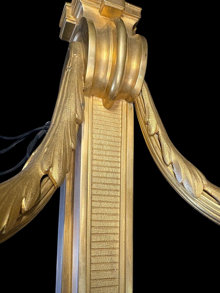 Pair of large Louis XVI-style bronze wall sconces, 19th century High-quality bronze wall sconces, chiselled, featuring an elegant design with two light points and a vase crowning the ensemble Dimensions: Height: 62 cm Width: 42 cm Depth: 22 cm