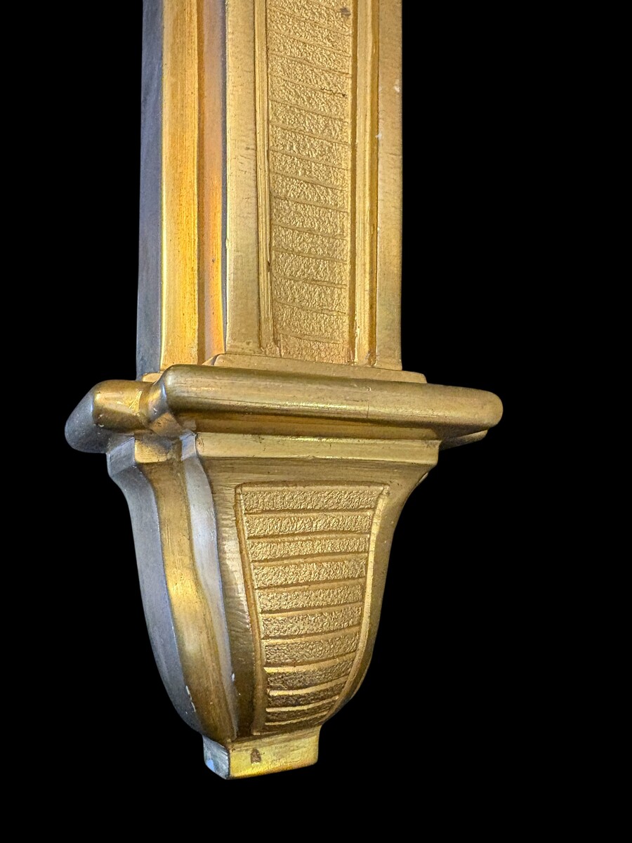 Pair of large Louis XVI-style bronze wall sconces, 19th century High-quality bronze wall sconces, chiselled, featuring an elegant design with two light points and a vase crowning the ensemble Dimensions: Height: 62 cm Width: 42 cm Depth: 22 cm