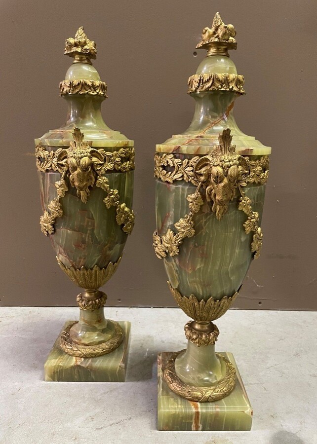 Pair of large onyx and gilded bronze cassolettes 19th century. Very decorative cassolettes in beautiful onyx decorated with girlandes and ram heads in gilt bronze. Both in very good condition Dimensions: Height : 55 cm Width : 21 cm Foot : 13 x 13 cm
