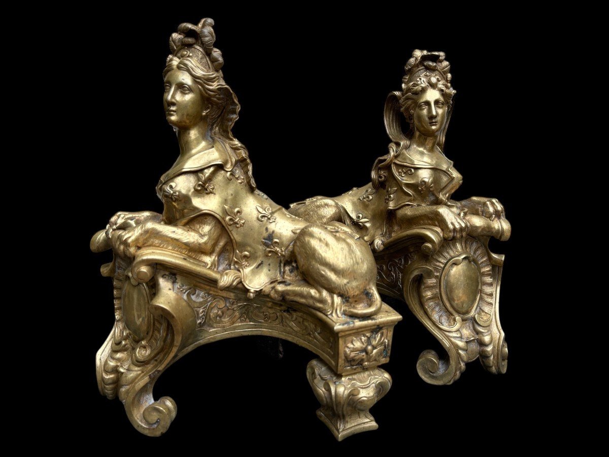 Pair of large Regency bronze ‘Sphinx’ andirons. Beautiful pair of gilt bronze andirons representing sphinxes supported by a coat of arms.Beautiful bronzes, high-quality workmanship, French,