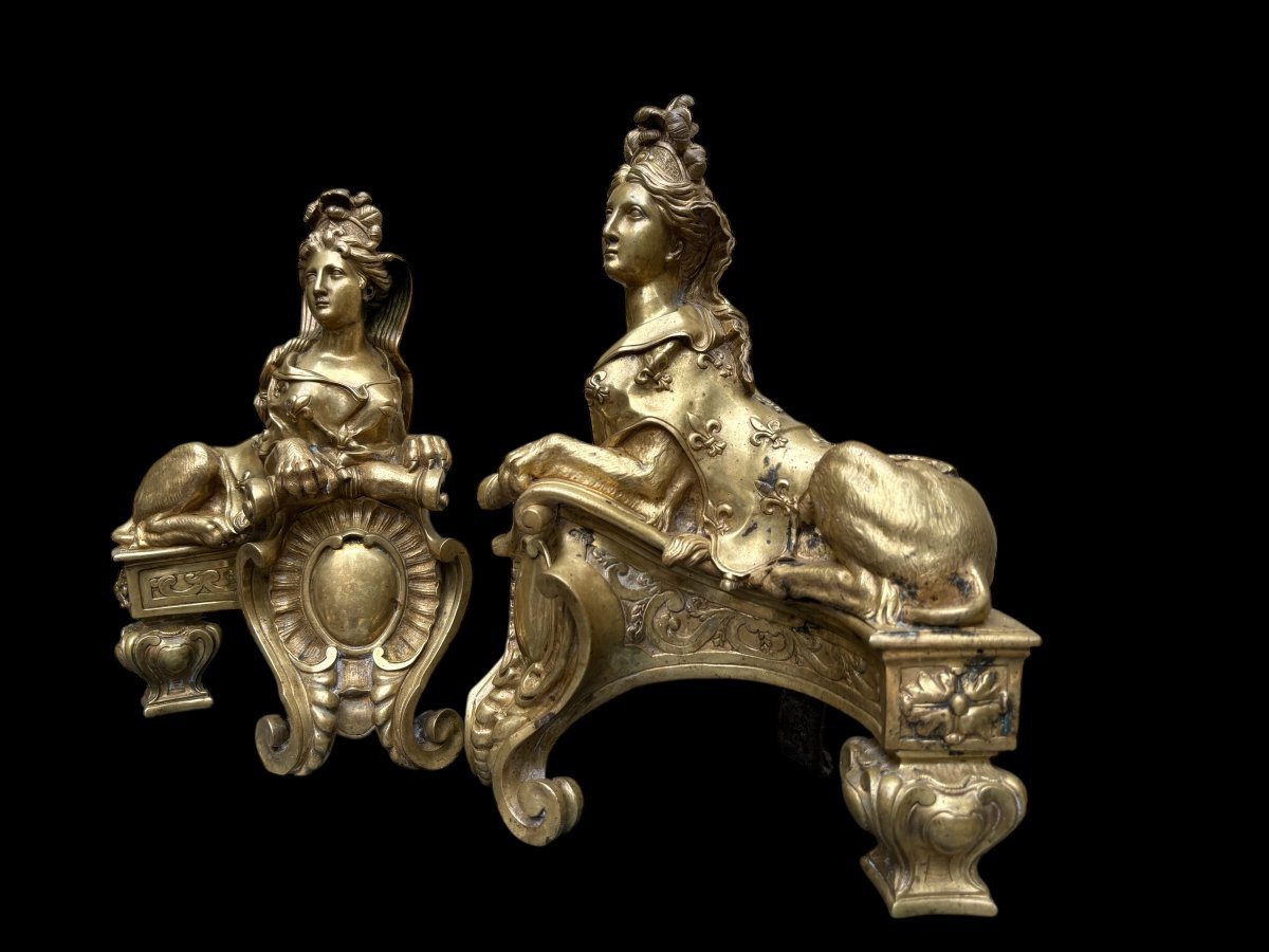 Pair of large Regency bronze ‘Sphinx’ andirons. Beautiful pair of gilt bronze andirons representing sphinxes supported by a coat of arms.Beautiful bronzes, high-quality workmanship, French,