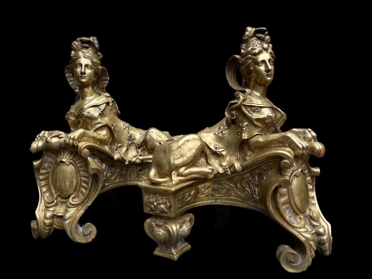 Pair of large Regency bronze ‘Sphinx’ andirons. Beautiful pair of gilt bronze andirons representing sphinxes supported by a coat of arms.Beautiful bronzes, high-quality workmanship, French