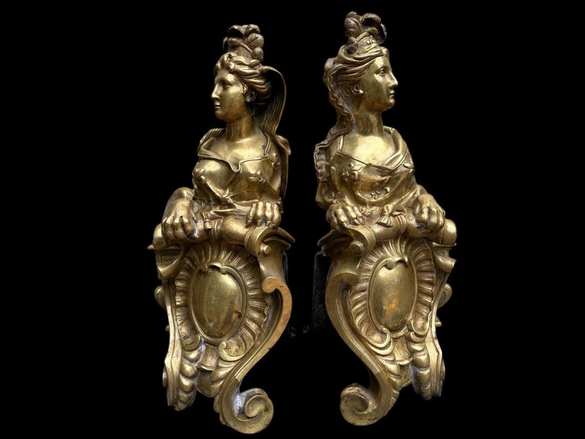 Pair of large Regency bronze ‘Sphinx’ andirons. Beautiful pair of gilt bronze andirons representing sphinxes supported by a coat of arms.Beautiful bronzes, high-quality workmanship, French