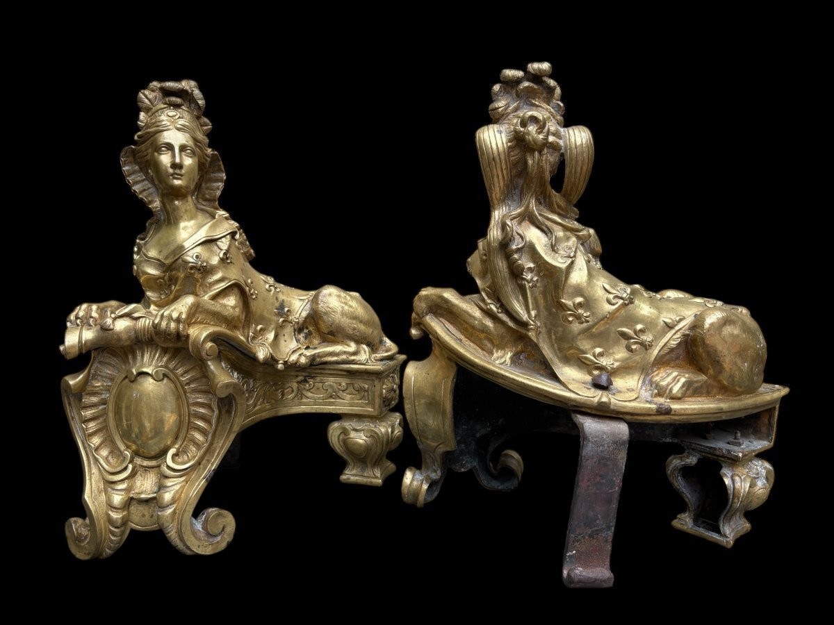 Pair of large Regency bronze ‘Sphinx’ andirons. Beautiful pair of gilt bronze andirons representing sphinxes supported by a coat of arms.Beautiful bronzes, high-quality workmanship, French